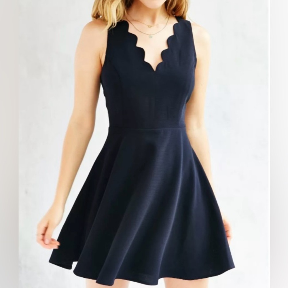 Kimchi Blue black sleeveless romper. Sz S. Dress/shorts. Scalloped straps.